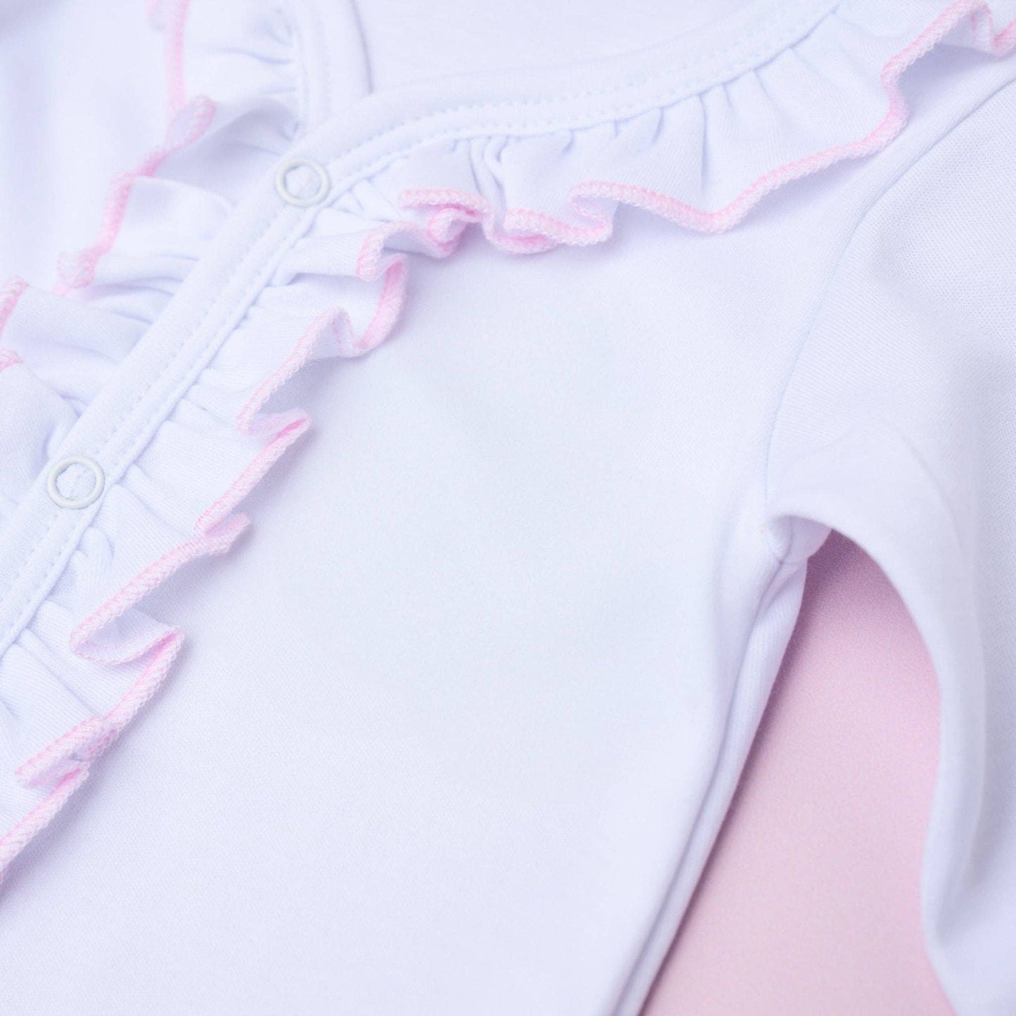 Magnolia Baby White Ruffle Footie with Pink Trim