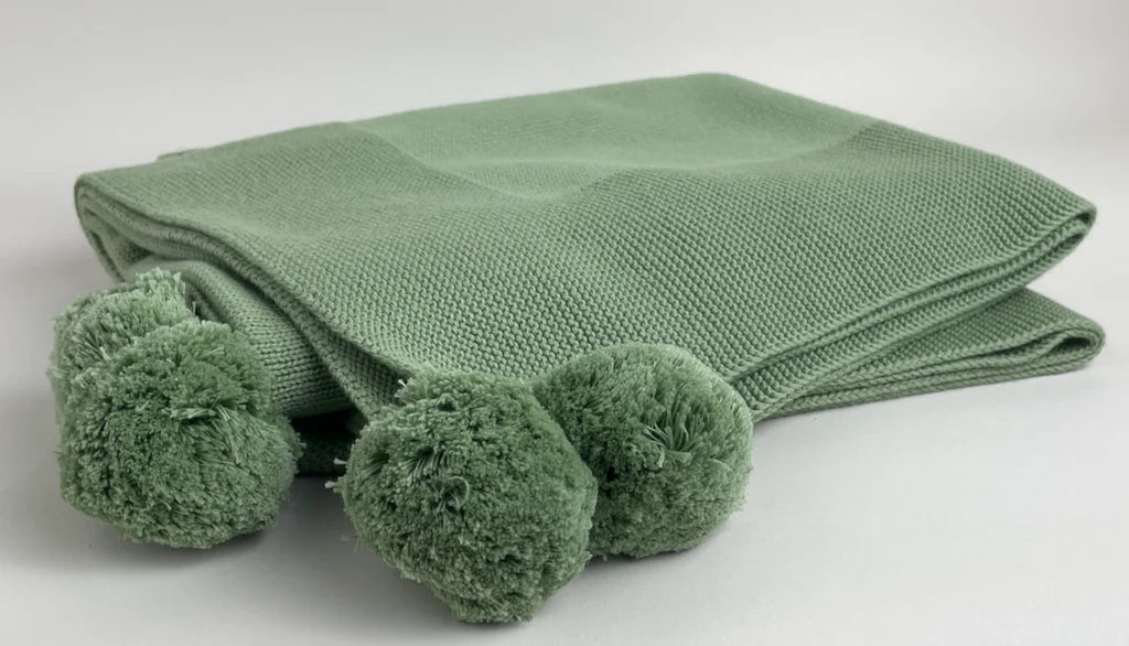 A Soft Idea Knit Baby Blanket with Pompoms